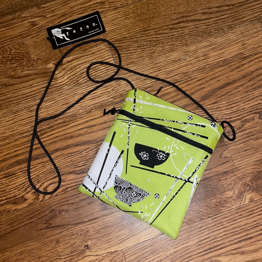 Across the shoulder green purse